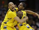 Marquette's Joseph Fulce, left, and Dwight Buycks celebrate a 66-62 win over Syracuse in an East regional NCAA college basketball tournament third-round game, Sunday, March 20, 2011, in Cleveland. Marquette advances to the Sweet 16.