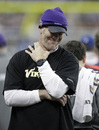 Minnesota Vikings quarterback Brett Favre stands on the sidelines during the first half against the Detroit Lions in their NFL football game in Detroit, Sunday, Jan. 2, 2011.