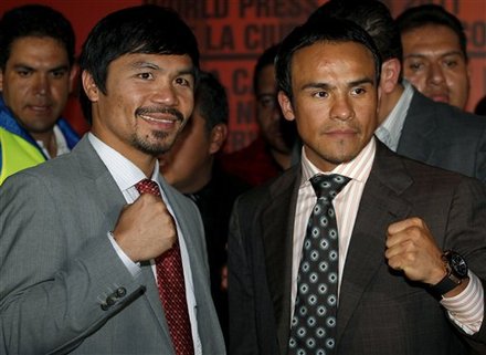 WBO Welterweight Champion Manny Pacquiao Of The Philippines, Left, And Mexican Challenger, Boxer Juan Manuel Marquez,