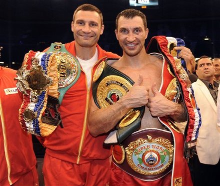 Heavyweight World Boxing Champion Wladimir Klitschko Of The Ukraine, Right, Celebrates With His Brother Vitali, Left,