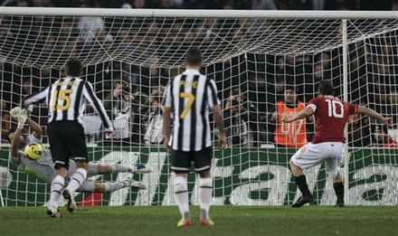Juventus Goalkeeper Gianluigi Buffon, Bottom Left, Saves A Penalty Kicked By AS Roma Forward Francesco Totti, Right,