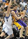 Los Angeles Lakers ' Pau Gasol , right, of Spain, is slowed down by Minnesota Timberwolves ' Darko Milicic of Serbia, during the first half of an NBA basketball game Friday, Nov. 19, 2010, in Minneapolis.
