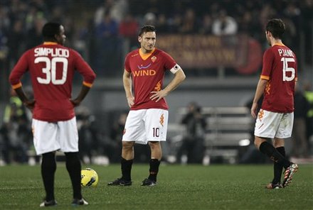 From Left, AS Roma Fabio Simplicio, Of Brazil, Francesco Totti And Miralem Pjanic, Of Bosnia, React