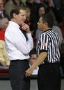 Oregon head coach Dana Altman, left, smiles at a referee in the second half against Stanford in an NCAA college basketball game in Stanford, Calif., Thursday, Jan. 27, 2011. Oregon defeated Stanford 67-59.