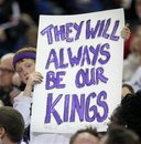 Sacramento Kings fan Ralph Miller IV, 9,   holds a sign conveying his sentiments during the Sacramento Kings NBA basketball game against the Los Angeles Lakers in Sacramento, Calif., Wednesday, April 13, 2011.  The Maloof family, majority owners of the Kings, are expected to go to New York later this week to ask the NBA permission to move the team to Anaheim.