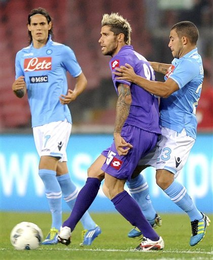 Napoli's Edinson Cavani, Of Uruguay, Left, And Walter Gargano, Right, Vie For The Ball With Valon Behrami, Of