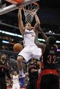 Los Angeles Clippers ' Blake Griffin , dunks the ball over Toronto Raptors ' James Johnson , left, DeMar DeRozan , rear, and Ed Davis , right, during the second half of an NBA basketball game in Los Angeles on Saturday, March 26, 2011. The Clippers won 94-90.