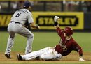 Arizona Diamondbacks ' Collin Cowgill , right, slides into second base with a double as San Diego Padres ' Jason Bartlett (8) waits for the ball in the seventh inning of a baseball game, Sunday, Aug. 28, 2011, in Phoenix. The Diamondbacks defeated the Padres 6-1, to sweep the series.