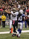 New Orleans Saints tight end Jimmy Graham (80) celebrates his touchdown reception in front of Indianapolis Colts strong safety David Caldwell (30) during the third quarter of an NFL football game at the Superdome in New Orleans, Sunday, Oct. 23, 2011.
