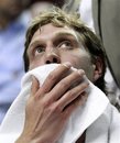Dallas Mavericks ' Dirk Nowitzki looks at the score board during a time out in the second quarter of Game 3 of their NBA basketball first-round playoff series with the Portland Trail Blazers Thursday, April 21, 2011, in Portland, Ore.  The Trail Blazers defeated Mavericks 97-92.