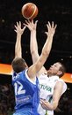 Lithuania's Darius Songaila throws on basket during the EuroBasket 2011, European Basketball Championships classification for 5th to 6th place match against Greece in Kaunas, Lithuania, Saturday, Sept. 17, 2011.