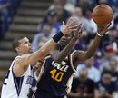 Sacramento Kings forward Francisco Garcia , left, goes after the ball against Utah Jazz forward Jeremy Evans during the second half of an NBA basketball game in Sacramento, Calif., Sunday, April 3, 2011. The Kings won 106-97.