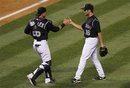 Colorado Rockies ' Jose Morales (26) celebrates with Colorado Rockies' Huston Street (16), who got the save, as the beat the Los Angeles Dodgers 9-7 during a baseball game Thursday, June 9, 2011 in Denver.