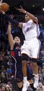 Oklahoma City Thunder guard Russell Westbrook , right, shoots in front of Atlanta Hawks guard Mike Bibby during the third quarter of an NBA basketball game in Oklahoma City, Friday, Dec. 31, 2010. Westbrook had 23 points, 10 rebounds and 10 assists as Oklahoma City won 103-94.