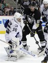 Pittsburgh Penguins ' Sidney Crosby , right, has a second-period shot blocked by Tampa Bay Lightning goalie Dwayne Roloson (35) during an NHL hockey game in Pittsburgh on Wednesday, Jan. 5, 2011. The Penguins won 8-1.