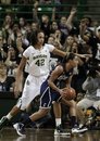 Connecticut guard Bria Hartley (14) attempts to get around Baylor center Brittney Griner (42) during an NCAA college basketball game Sunday, Dec. 18, 2011, in Waco, Texas. Baylor won 66-61.