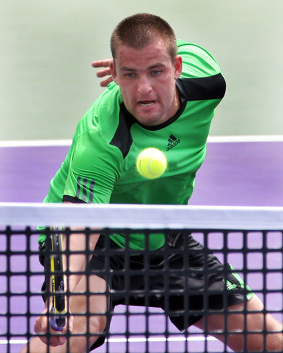 Mikhail Youzhny , of Russia, makes the play at the net against Olivier Rochus , of Belgium, at the Sony Ericsson Open tennis tournament in Key Biscayne Fla,, Monday March 28, 2011.