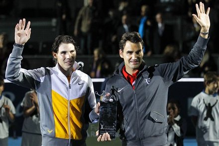 Switzerland's Roger Federer, Right, And Spain's Rafael Nadal, Left, Wave