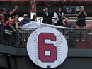 Former Atlanta Braves manager Bobby Cox is honored by the team as his No. 6  is retired and placed in left field during a ceremony before the Chicago Cubs baseball game, Friday, Aug. 12, 2011, at Turner Field in Atlanta.