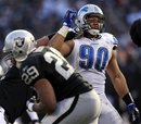 Detroit Lions defensive tackle Ndamukong Suh (90) rushes Oakland Raiders quarterback Carson Palmer during the third quarter of an NFL football game in Oakland, Calif., Sunday, Dec. 18, 2011. The Lions won 28-27.