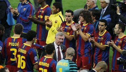 Manchester United's Manager Alex Ferguson, Center, Walks