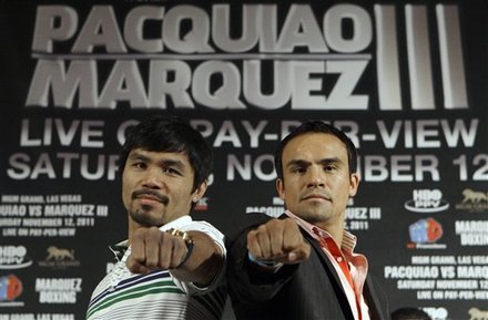 Manny Pacquiao Of The Philippines, Left, And Juan Manuel Marquez, Of Mexico, Pose At A News