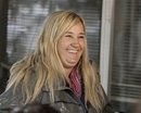 In this photo taken April 24, 2011, trainer Kathy Ritvo reacts to a question about her Kentucky Derby hopeful Mucho Macho Man after the colt worked over a muddy track at Churchill Downs in Louisville, Ky.