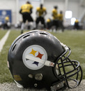 The Pittsburgh Steelers do some running behind one of their helmets on the sideline during warmup drills before NFL football practice in Pittsburgh, Friday, Jan. 28, 2011. The Steelers will be facing the Green Bay Packers in Super Bowl XLV on Feb. 6, 2011 in Arlington, Texas.