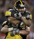 FILE - This Dec. 28, 2010, file photo shows Iowa running back Marcus Coker being lifted by a teammate after scoring a touchdown against Missouri during the first quarter of the Insight Bowl NCAA college football game, in Tempe, Ariz. Coker began his first season with the Hawkeyes hampered by a broken collarbone. He finished it with a flourish, and the soft-spoken Coker is hoping a full off-season in Iowa's strength program will pay big dividends in the fall.