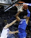 Kentucky's Terrence Jones (3) is fouled under the basket by Portland's Nemanja Mitrovic (33) during the second half of an NCAA basketball game in Portland, Ore., Friday Nov.10, 2010. Kentucky beat Portland 79-48.