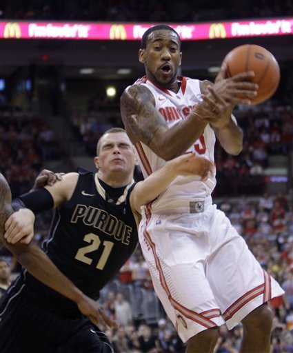 Ohio State 's David Lighty, right, is fouled by Purdue's D.J. Byrd as he grabs a rebound during the first half of an NCAA college basketball game Tuesday, Jan. 25, 2011, in Columbus, Ohio.