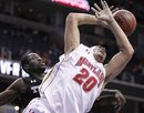 Maryland's Jordan Williams (20) is fouled by Temple's Micheal Eric, left, during first half of an NCAA college basketball game at the 16th Annual BB&T Classic in Washington, Sunday, Dec. 5, 2010.