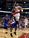 Toronto Raptors '  Leandro Barbosa , right, of Brazil, is fouled by Detroit Pistons ' Will Bynum during second half NBA basketball action in Toronto Wednesday, Dec. 22, 2010.