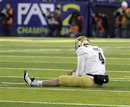 UCLA quarterback Kevin Prince sits on the field after a rough sack during the second half of their NCAA Pac-12 Championship game against Oregon in Eugene, Ore., Friday, Dec. 2, 2011.  UCLA lost to Oregon 49-31