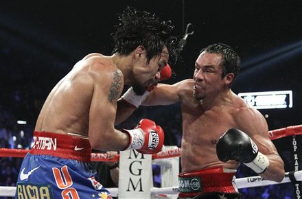 Juan Manuel Marquez, Right, And Manny Pacquiao Exchanges