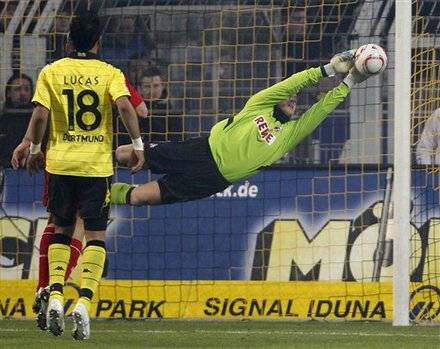 Cologne Goalkeeper Michael Rensing Catches