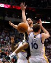 Utah Jazz guard Deron Williams , left, is fouled by Golden State Warriors center David Lee (10) as he drives to the basket during the second half of an NBA basketball game in Salt Lake City, Wednesday, Feb. 16, 2011. The Warriors beat the Jazz 107-100.