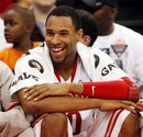 Ohio State 's Jared Sullinger smiles as he sits on the bench during the second half of an NCAA college basketball game against Valparaiso , Friday, Nov. 25, 2011, in Columbus, Ohio. Ohio State won 80-47.