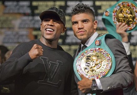 Floyd Mayweather, Left, And Victor Ortiz Square Off For A Photo