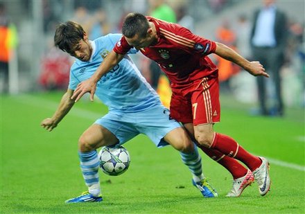 Munich's Franck Ribery Of France Right, And Manchester City's David Silvachallenge For The Ball