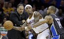 Orlando Magic head coach Stan Van Gundy, left, watches as Magic's Jameer Nelson (14) puts pressure on Cleveland Cavaliers ' Daniel Gibson (1) in the fourth quarter of an NBA basketball game, Monday, March 21, 2011, in Cleveland. The Magic won 97-86.