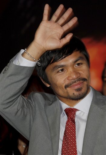 WBO Welterweight Champion Manny Pacquiao Of The Philippines Waves