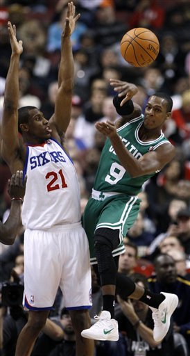 Boston Celtics' Rajon Rondo, Right, Gets