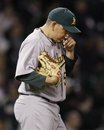 Oakland Athletics relief pitcher Brian Fuentes reacts during the eighth inning of a baseball game against the Chicago White Sox in Chicago, Thursday, June 9, 2011. The White Sox won 9-4.