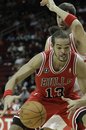 Chicago Bulls ' Joakim Noah (13) tries to get to the basket past Houston Rockets ' Brad Miller during the first half of an NBA basketball game Tuesday, Nov. 16, 2010 in Houston.