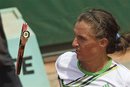 Alexandr Dolgopolov of the Ukraine watches his racket fall to the ground after he threw it into the air missing a return against Viktor Troicki of Serbia in his third round match at the French Open tennis tournament in Roland Garros stadium in Paris, Saturday May 28, 2011.