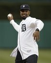 Charles Woodson , former Heisman Trophy winner at the University of Michigan and current Green Bay Packers player, throws a ceremonial first pitch before the Detroit Tigers and theSeattle Mariners baseball game in Detroit, Wednesday, April 27, 2011.