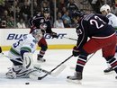 Vancouver Canucks goalie Cory Schneider(notes), left, stops a shot in front of Columbus Blue Jackets&#39; Tom Sestito(notes) in the second period of an NHL hockey game in Columbus, Ohio, Thursday, Dec. 23, 2010.