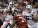 Indianapolis Colts quarterback Curtis Painter , left, looks for a receiver tackle Mike Tepper (67) blocks Tampa Bay Buccaneers defensive end Michael Bennett (71) during the second half of an NFL football game early Tuesday, Oct. 4, 2011, in Tampa, Fla. Tampa Bay won 24-17.