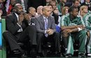 In this photo taken Tuesdauy, April 19, 2011, Boston Celtics center Shaquille O'Neal , far left, whistles from the bench during the first quarter against the New York Knicks in Game 2 of a first-round NBA basketball playoff series in Boston. Celtics head coach Doc Rivers announced Wednesday, April 20, that O'Neal will miss his third straight playoff game with a right calf injury when they meet the Knicks on Friday night in Game 3.